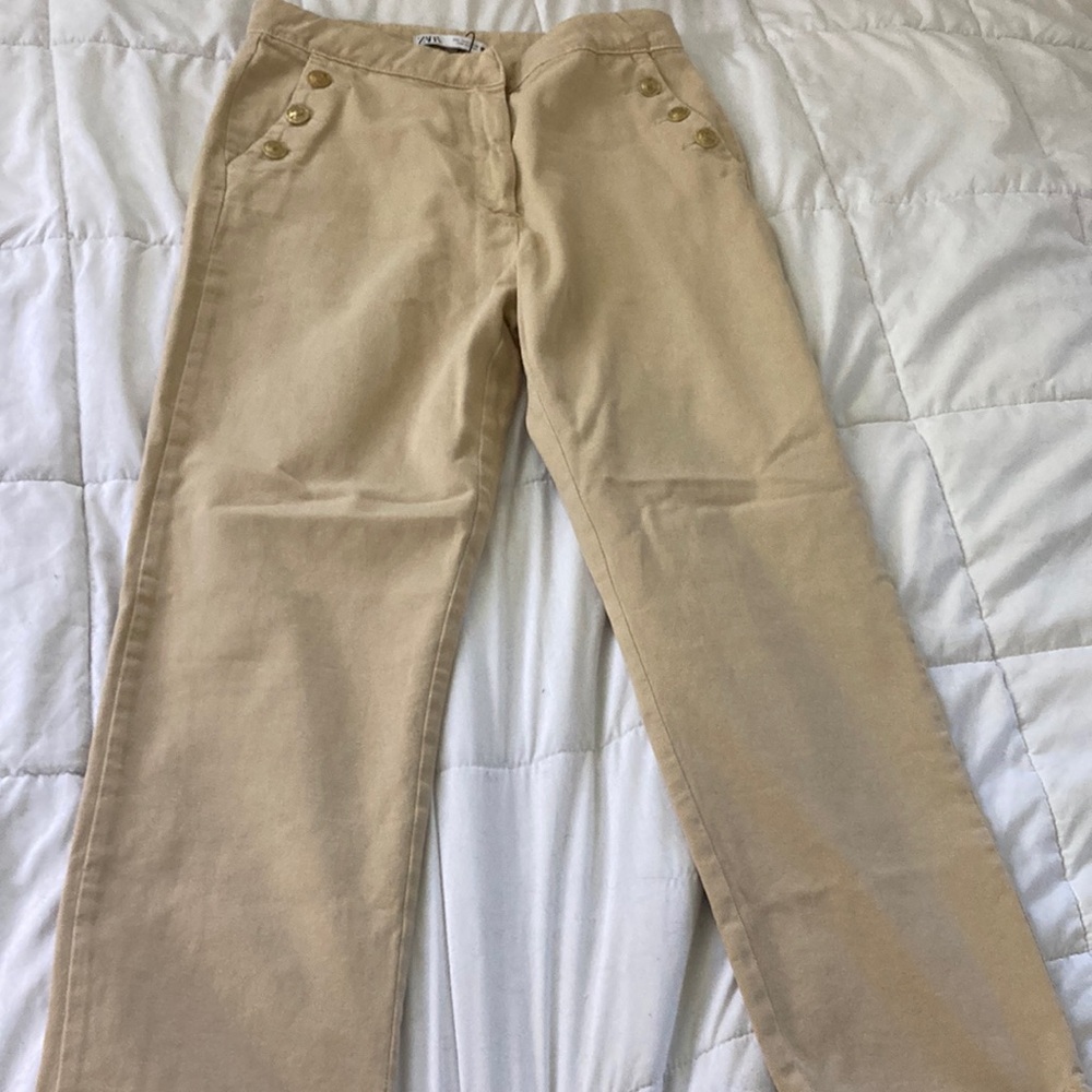 New tan denim woman’s pants with gold buttons.  Size large, ZARA.